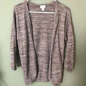 Grey cardigan with black and light grey spots.